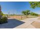 Community baseball field with an enclosed backstop surrounded by greenery, near a walking path at 11875 W Lone Tree Trl, Peoria, AZ 85383