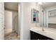 Stylish bathroom featuring tile floors, vanity with a dark wood, and shower with patterned curtain at 11875 W Lone Tree Trl, Peoria, AZ 85383