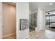 Bright bathroom boasts a walk-in shower, a walk-in closet, and neutral tile flooring at 11875 W Lone Tree Trl, Peoria, AZ 85383
