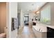 An open bathroom featuring a soaking tub, walk-in shower, and access to the primary bedroom at 11875 W Lone Tree Trl, Peoria, AZ 85383