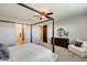 Bedroom boasts a four-poster bed and ample space with views to bathroom and closet at 11875 W Lone Tree Trl, Peoria, AZ 85383