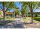 Well landscaped path toward the clubhouse with modern architecture and desert plants at 11875 W Lone Tree Trl, Peoria, AZ 85383