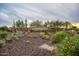 Beautiful community entrance to Vistancia, with desert landscaping and a stone sign with a mountain backdrop at 11875 W Lone Tree Trl, Peoria, AZ 85383