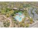 Aerial view of a sparkling community pool with ample seating and lush landscaping near the parking area at 11875 W Lone Tree Trl, Peoria, AZ 85383