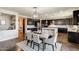Open floor plan showcases a dining area adjacent to a gourmet kitchen, perfect for gatherings and entertaining guests at 11875 W Lone Tree Trl, Peoria, AZ 85383