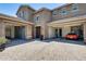 Charming two-story home with a brick-paved driveway and multiple garages at 11875 W Lone Tree Trl, Peoria, AZ 85383