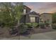 Charming two-story home with a well-maintained yard and beautiful dusk sky backdrop at 11875 W Lone Tree Trl, Peoria, AZ 85383
