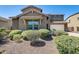 Charming two-story home with desert landscaping and a two-car garage, offering curb appeal and functionality at 11875 W Lone Tree Trl, Peoria, AZ 85383