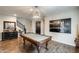 This game room boasts a stylish pool table, elegant decor, and modern lighting at 11875 W Lone Tree Trl, Peoria, AZ 85383