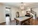 Charming game room features a pool table and designer lighting at 11875 W Lone Tree Trl, Peoria, AZ 85383