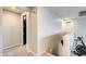 Upstairs hallway featuring neutral colors and plush carpet leading to a bedroom at 11875 W Lone Tree Trl, Peoria, AZ 85383