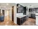 This kitchen features stainless steel appliances, granite countertops and dark cabinets at 11875 W Lone Tree Trl, Peoria, AZ 85383