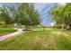 Beautiful green park with walking paths and open spaces, perfect for outdoor activities at 11875 W Lone Tree Trl, Peoria, AZ 85383