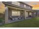 Covered patio features comfortable seating and ample space for outdoor living at 11875 W Lone Tree Trl, Peoria, AZ 85383
