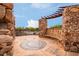 Beautiful patio with stone pillars, pergola, mosaic art, and a bench perfect for relaxing at 11875 W Lone Tree Trl, Peoria, AZ 85383