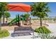 Community playground with a colorful playset, climbing wall, slides, and a shaded picnic area for Gathering enjoyment at 11875 W Lone Tree Trl, Peoria, AZ 85383