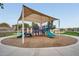 Community playground features a canopy shade structure over modern equipment, encouraging outdoor fun for families at 11875 W Lone Tree Trl, Peoria, AZ 85383