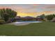 Backyard pool oasis with elegant landscaping and ample space for relaxation at 11875 W Lone Tree Trl, Peoria, AZ 85383