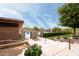 Pool access with secure gate, steps, and flower planters providing a welcoming entrance at 11875 W Lone Tree Trl, Peoria, AZ 85383