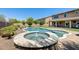 Private outdoor oasis complete with pool, spa, and spacious patio area for ultimate relaxation and entertainment at 11875 W Lone Tree Trl, Peoria, AZ 85383