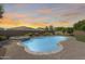 Stunning pool and spa combination with a brick surround, set in a private backyard oasis with desert landscaping at 11875 W Lone Tree Trl, Peoria, AZ 85383