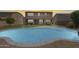 Inviting backyard with a sparkling pool and a covered patio, perfect for outdoor entertaining and relaxation at 11875 W Lone Tree Trl, Peoria, AZ 85383
