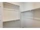 Bright walk-in closet featuring shelving and a chrome hanging rod at 11875 W Lone Tree Trl, Peoria, AZ 85383