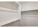Bright walk-in closet featuring shelving and a chrome hanging rod at 11875 W Lone Tree Trl, Peoria, AZ 85383