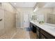 Bathroom with large walk-in shower, double sinks, and vanity at 12027 S 183Rd Dr, Goodyear, AZ 85338