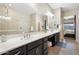 Bathroom with a large vanity, double sinks, and walk-in shower at 12027 S 183Rd Dr, Goodyear, AZ 85338