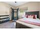 Bedroom featuring workout equipment, natural light, and a queen bed at 12027 S 183Rd Dr, Goodyear, AZ 85338
