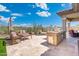 Outdoor kitchen featuring a built-in grill and ample counter space for entertaining at 12027 S 183Rd Dr, Goodyear, AZ 85338