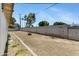 Spacious backyard area, enclosed by a block wall, with potential for landscaping and customization at 1215 E Geneva Dr, Tempe, AZ 85282