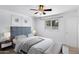 Stylishly furnished bedroom with plush bed, coordinated decor, and ample natural light at 1215 E Geneva Dr, Tempe, AZ 85282
