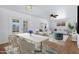 Bright dining area featuring a modern table setting and seamless flow into the living space with stylish decor at 1215 E Geneva Dr, Tempe, AZ 85282