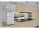 This kitchen features light-colored cabinets and stainless steel appliances at 1215 E Geneva Dr, Tempe, AZ 85282