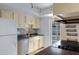 This kitchen features natural stone floors, stainless steel appliances and lots of light at 1215 E Geneva Dr, Tempe, AZ 85282