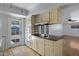 Open kitchen with tiled floors, built-in oven, and view to the bright living room at 1215 E Geneva Dr, Tempe, AZ 85282