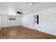 This living room boasts new floors, white walls and lots of bright, natural light at 1215 E Geneva Dr, Tempe, AZ 85282