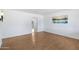 Bright, airy living room with neutral paint, and stylish light wood floors, perfect for entertaining at 1215 E Geneva Dr, Tempe, AZ 85282