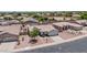 Aerial view of a single Gathering home with desert landscaping, a two-car garage and a tile roof at 15019 W Banff Ln, Surprise, AZ 85379