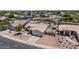 Aerial view of a single-Gathering home with desert landscaping, and a covered patio at 15019 W Banff Ln, Surprise, AZ 85379