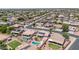 A high altitude aerial view of a planned residential community with single Gathering homes and neighborhood streets at 15019 W Banff Ln, Surprise, AZ 85379