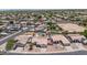 High altitude aerial view of a planned residential community with similar houses, landscaping, and tile roofs at 15019 W Banff Ln, Surprise, AZ 85379