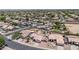High altitude aerial shot of a neighborhood community featuring solar panels on the houses at 15019 W Banff Ln, Surprise, AZ 85379
