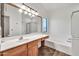 Well-lit bathroom featuring a spacious vanity and separate tub and shower areas at 15019 W Banff Ln, Surprise, AZ 85379