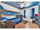 Themed bedroom with a bunk bed, star ceiling, and dark gray rug at 15019 W Banff Ln, Surprise, AZ 85379