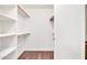 Spacious walk-in closet with built-in shelving, offering ample storage and organization solutions at 15019 W Banff Ln, Surprise, AZ 85379