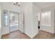 Bright entryway featuring wood-look tile flooring and a decorative security screen door at 15019 W Banff Ln, Surprise, AZ 85379