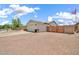 Property exterior, with desert landscaping and a two car garage at 15019 W Banff Ln, Surprise, AZ 85379